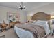 Inviting bedroom featuring neutral tones, soft lighting, and a comfortable rocking chair at 619 E Pelham Ne Rd, Atlanta, GA 30324