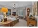 Spacious bedroom with a mix of antique and modern decor with lots of natural light at 619 E Pelham Ne Rd, Atlanta, GA 30324