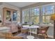 Cozy breakfast room featuring hardwood floors, natural light, and seating for four around a tulip table at 619 E Pelham Ne Rd, Atlanta, GA 30324