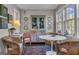 Charming dining area with wicker chairs, natural light, and colorful decor at 619 E Pelham Ne Rd, Atlanta, GA 30324