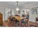Elegant dining room with chandelier, hardwood floors, and classic architectural details at 619 E Pelham Ne Rd, Atlanta, GA 30324