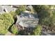 Aerial view of a brick two-story home with black shutters and mature landscaping at 619 E Pelham Ne Rd, Atlanta, GA 30324