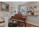 Bright hallway featuring a grand piano, paintings and natural light from a window at 619 E Pelham Ne Rd, Atlanta, GA 30324