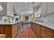 Open kitchen view into adjacent eating area with white counters and updated appliances at 619 E Pelham Ne Rd, Atlanta, GA 30324