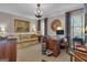 Comfortable living room with desk and view of outdoor scenery through window at 619 E Pelham Ne Rd, Atlanta, GA 30324
