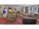 Spacious living room with unique star-patterned red carpet, cozy seating, and elegant decor at 619 E Pelham Ne Rd, Atlanta, GA 30324