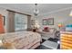 Bright main bedroom featuring a comfortable couch, a decorative mirror, and an elegant chandelier at 619 E Pelham Ne Rd, Atlanta, GA 30324