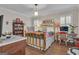 Bright bedroom with a brass bed frame, shutters and hardwood flooring at 619 E Pelham Ne Rd, Atlanta, GA 30324