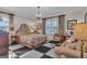 Comfortable main bedroom featuring black and white checkered floors and a cozy sitting area with a couch at 619 E Pelham Ne Rd, Atlanta, GA 30324