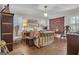 Bright bedroom with a brass bed frame, shutters and natural light at 619 E Pelham Ne Rd, Atlanta, GA 30324