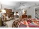 Spacious main bedroom with a ceiling fan, carpet and doorway views to adjoining rooms at 619 E Pelham Ne Rd, Atlanta, GA 30324