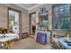 Bright sunroom offering great natural light, charming decor, and connection to other rooms at 619 E Pelham Ne Rd, Atlanta, GA 30324