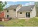 Backyard view with deck and patio, ideal for outdoor activities and relaxation at 909 Chapman Cir, Stone Mountain, GA 30088