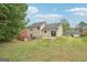 Backyard view with a green lawn at 909 Chapman Cir, Stone Mountain, GA 30088