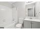 Bathroom with tub and shower combination and vanity with sink, mirror and toilet at 909 Chapman Cir, Stone Mountain, GA 30088