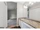 Spacious bathroom featuring a modern vanity and a view to the bedroom at 909 Chapman Cir, Stone Mountain, GA 30088