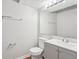 Bathroom features a vanity with sink, a mirror and a toilet at 909 Chapman Cir, Stone Mountain, GA 30088