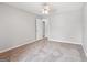 Neutral bedroom with soft carpet, light walls, and a view to another room at 909 Chapman Cir, Stone Mountain, GA 30088
