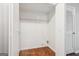 A closet featuring hardwood floors, neutral paint and shelving at 909 Chapman Cir, Stone Mountain, GA 30088