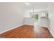 A dining room featuring hardwood floors, neutral paint and sliding glass doors at 909 Chapman Cir, Stone Mountain, GA 30088