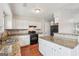 Bright kitchen with stainless steel appliances and granite countertops at 909 Chapman Cir, Stone Mountain, GA 30088