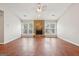 Spacious living room features a stone fireplace, laminate floors and large windows at 909 Chapman Cir, Stone Mountain, GA 30088