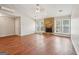 Spacious living room features a stone fireplace, laminate floors and large windows at 909 Chapman Cir, Stone Mountain, GA 30088