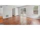 A living room featuring hardwood floors, neutral paint, and a sliding glass door at 909 Chapman Cir, Stone Mountain, GA 30088