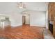 Bright living room with hardwood floors, stone fireplace and staircase at 909 Chapman Cir, Stone Mountain, GA 30088