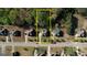 Aerial view of the property showcasing the layout and landscaping in relation to nearby homes at 117 Berkeley Way, Hampton, GA 30228