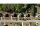 Overhead aerial view of multiple homes in a suburban neighborhood, showing street layout and property sizes at 117 Berkeley Way, Hampton, GA 30228