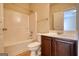 Clean bathroom featuring shower-tub combo, vanity, toilet, and tile flooring at 117 Berkeley Way, Hampton, GA 30228