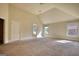 A large bedroom with carpet flooring and several windows, offering ample natural light at 117 Berkeley Way, Hampton, GA 30228