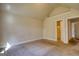 A sunlit room with neutral carpet and paint, offering a blank canvas for personalization and relaxation at 117 Berkeley Way, Hampton, GA 30228