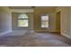 Bright bedroom with large windows offering ample light and connecting doors at 117 Berkeley Way, Hampton, GA 30228