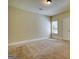 Bright bedroom featuring a window and door offering peaceful retreat at 117 Berkeley Way, Hampton, GA 30228