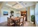 Inviting dining room with coffered ceilings, elegant furniture, and access to the kitchen at 117 Berkeley Way, Hampton, GA 30228