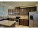 Well-equipped kitchen with stainless steel appliances, granite countertops, and ample cabinet space at 117 Berkeley Way, Hampton, GA 30228