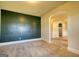 Inviting living room with an archway to dining area and modern kitchen at 117 Berkeley Way, Hampton, GA 30228
