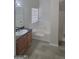 Bathroom featuring a soaking tub, shower, vanity with sink, and wood look floors at 1354 Persimmon Ct, Lithonia, GA 30058