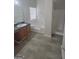 Bathroom featuring a soaking tub, shower, vanity with sink, and wood look floors at 1354 Persimmon Ct, Lithonia, GA 30058