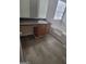 Bathroom featuring a soaking tub, vanity with sink, and wood look floors at 1354 Persimmon Ct, Lithonia, GA 30058