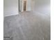 Large bedroom with doors leading to the hallway and closet, and light gray carpeting at 1354 Persimmon Ct, Lithonia, GA 30058