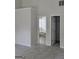 Spacious bedroom with neutral tones, carpet, and access to a bathroom and closet at 1354 Persimmon Ct, Lithonia, GA 30058