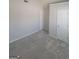 Bright bedroom featuring neutral paint, plush carpeting, and two paneled doors at 1354 Persimmon Ct, Lithonia, GA 30058