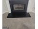 Traditional fireplace design featuring white corbels, a black surround, and a metal mesh screen at 1354 Persimmon Ct, Lithonia, GA 30058