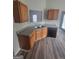 Functional kitchen features wood cabinetry, stainless steel sink, and modern dishwasher at 1354 Persimmon Ct, Lithonia, GA 30058