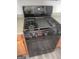 Close up of the black gas range at 1354 Persimmon Ct, Lithonia, GA 30058
