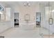 Luxurious bathroom boasts a freestanding tub, elegant fixtures, and marble flooring at 504 Telfair Park, Peachtree City, GA 30269