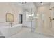 Modern bathroom with a stand alone tub, glass enclosed shower, and elegant fixtures at 504 Telfair Park, Peachtree City, GA 30269